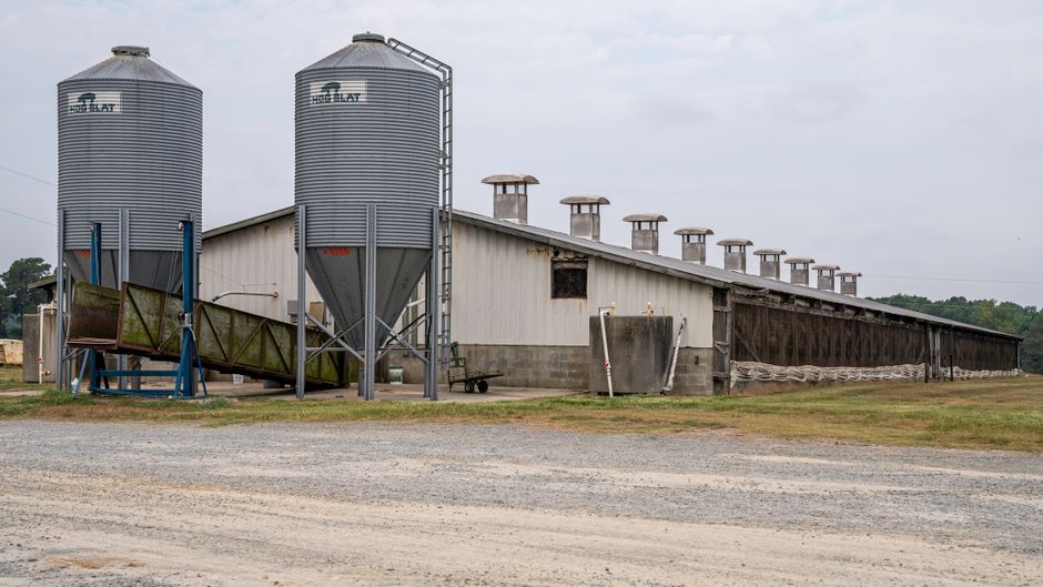 Metal farm building with agricultural silos on a North Carolina farm — steel buildings for farms in Raleigh NC